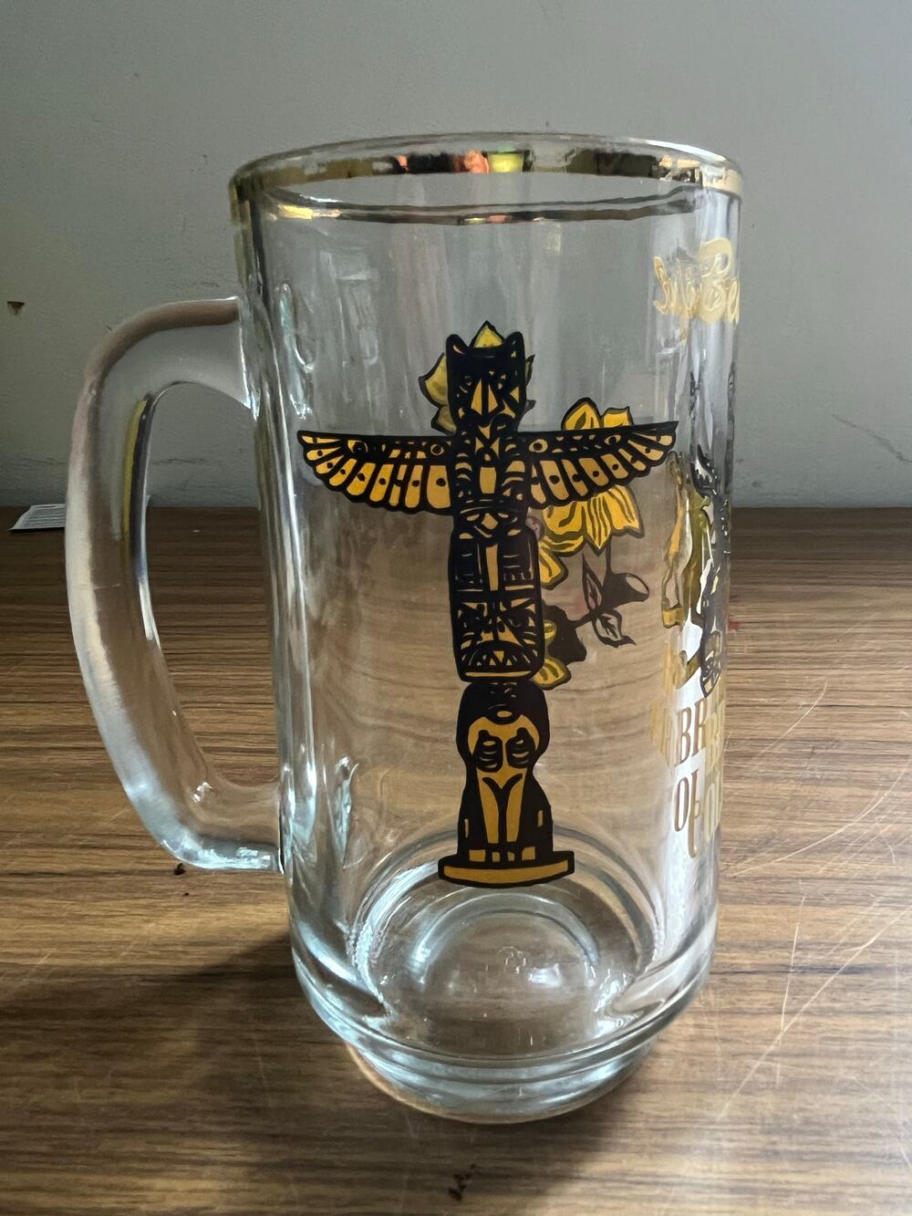 Clear glass beer stein with gold rim British Columbia souvenir graphic